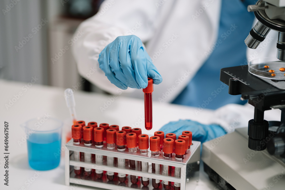 Medical test vaccine research and development concept. Scientist in laboratory study and analyze scientific sample of antibody. Medical test vaccine research and development concept. Scientist in laboratory study and analyze scientific sample of antibody.