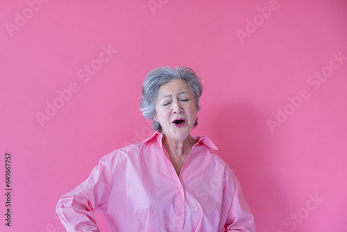 Portrait of a senior woman singing and dancing