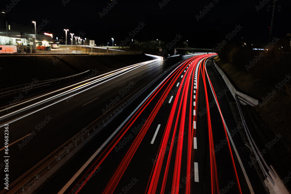 traffic on highway at night light trails mainly backlight