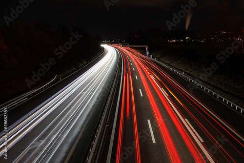 traffic on highway at night light trails