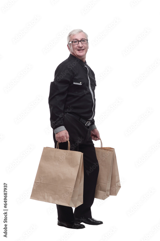 in full growth. happy casual man with shopping bags. in full growth. happy casual man with shopping bags.