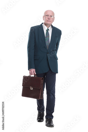 confident business man with a briefcase looking at you.