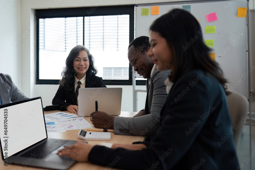 Group businesspeople diverse ethnicity on analysis financial data report paper on meeting table discussion to plan for data analysis at office concept diversity ethnicity Group businesspeople diverse ethnicity on analysis financial data report paper on meeting table discussion to plan for data analysis at office concept diversity ethnicity