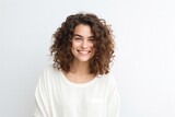 portrait of a confident Israeli woman in her 20s wearing a chic cardigan against a white background