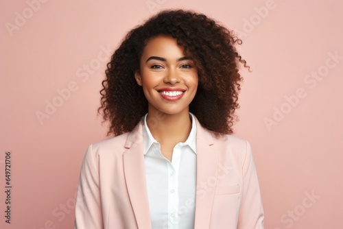medium shot portrait of a confident Kenyan woman in her 20s wearing a classic blazer against a pastel or soft colors background photo