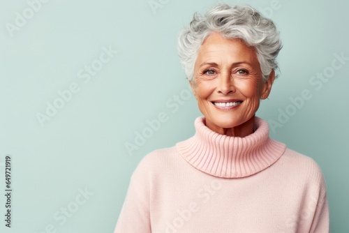 medium shot portrait of a confident Kenyan woman in her 70s wearing a cozy sweater against a pastel or soft colors background