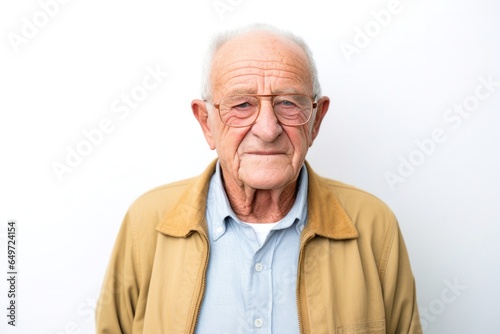 medium shot portrait of a Israeli man in his 60s wearing a chic cardigan against a white background