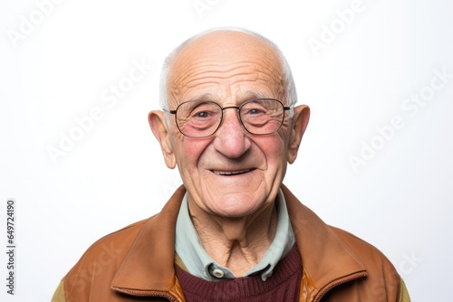 medium shot portrait of a happy Israeli man in his 90s wearing a chic cardigan against a white background