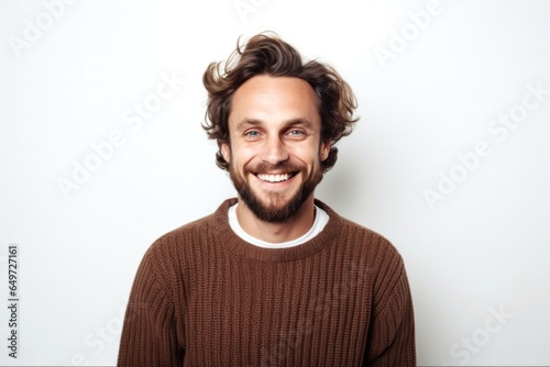 medium shot portrait of a happy Polish man in his 30s wearing a chic cardigan against a white background