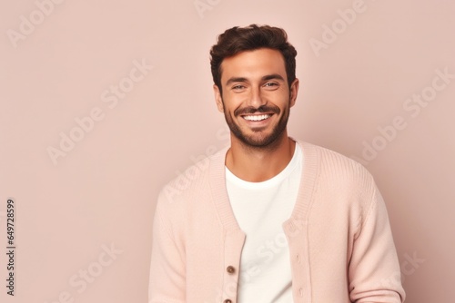 medium shot portrait of a Israeli man in his 20s wearing a chic cardigan against a pastel or soft colors background