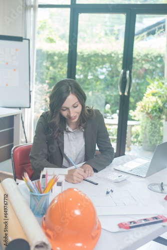 Two brunette business woman, talking, advising each other.