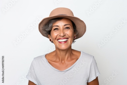Obraz na płótnie Cheerful senior woman with white cap smiling for a close-up portrait w salonie