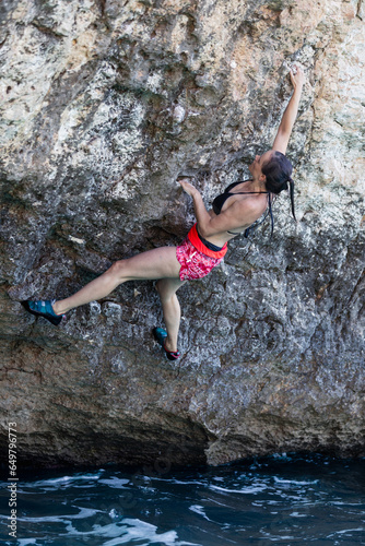 Women climbing. No rope, action sport. Excitement. 