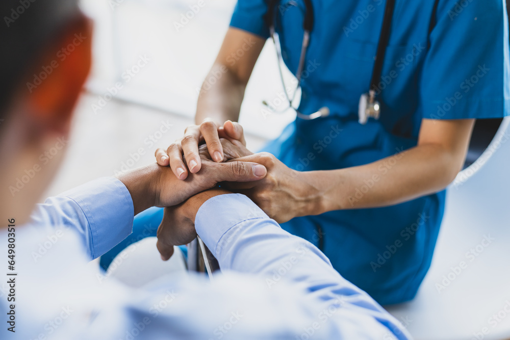 Female doctor is giving physical therapy advice to a male patient in a wheelchair. Female doctor is giving physical therapy advice to a male patient in a wheelchair.
