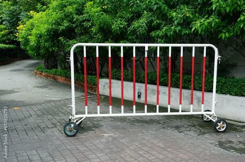 A trolley of a traffic protections don't let bicycles pass, Only walking only  in the park.