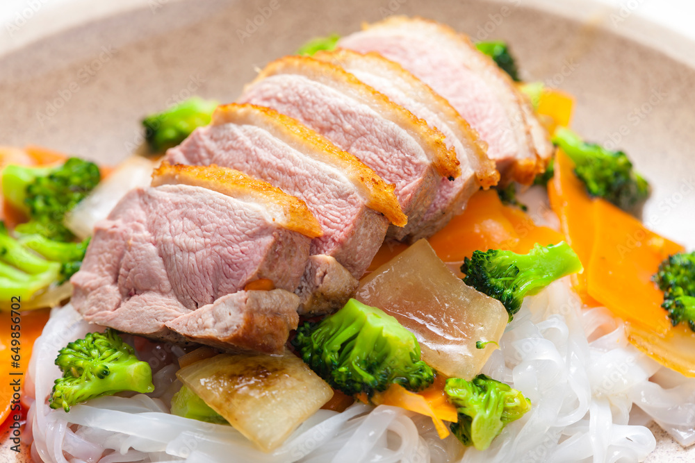 baked duck breast with vegetables and rice noodles