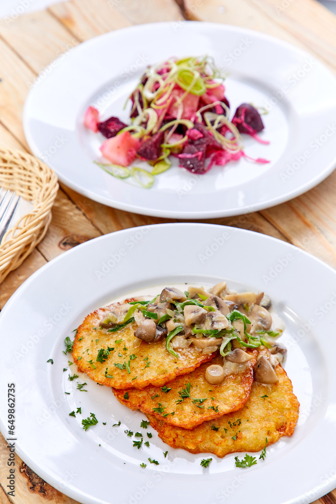 potato pancakes with sauce and mushrooms potato pancakes with sauce and mushrooms