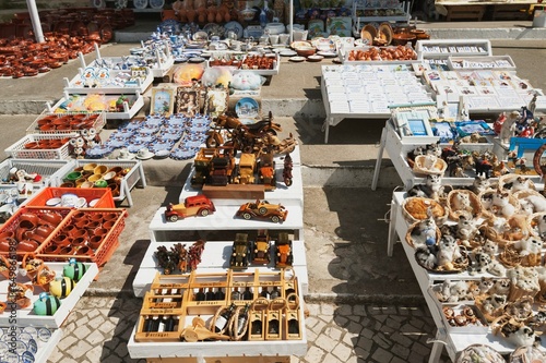 Souvenirs Set On Tables At The Seaside Town Of Nazare; Nazare, Estremadura And Ribatejo, Portugal photo