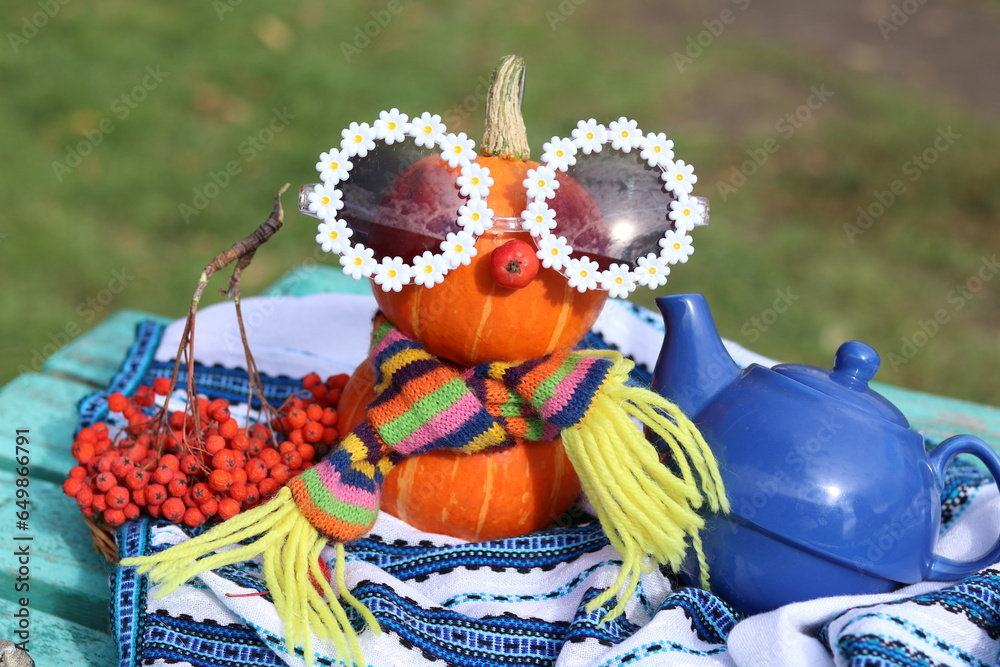 Fototapeta premium scarecrow with pumpkin