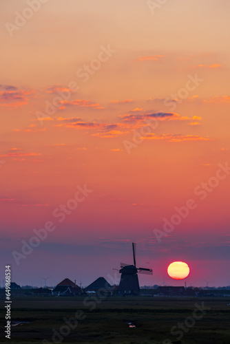 Sunrise with windmill Hargermolen, Bergen - Schoorl, The Netherlands photo