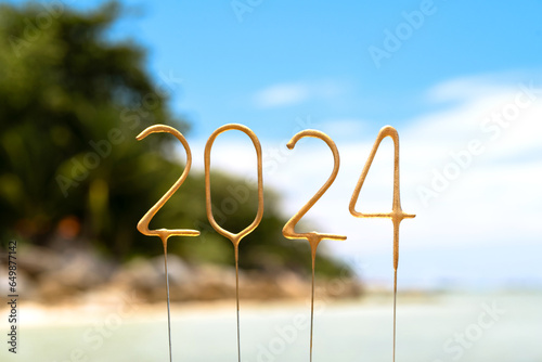 Numbers 2024 for the upcoming New Year among the waves on a sunny beach. Celebration concept in exotic country