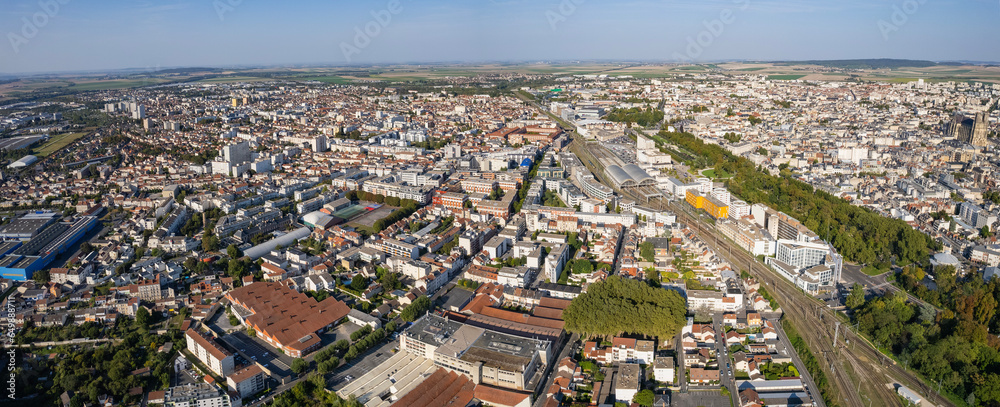 Aerial around the west part of the city Reims in France on a late afternoon.