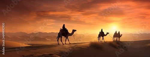 a caravan of Indian camels, led by experienced camel drivers, traversing the mesmerizing desert sand dunes at sunset. The warm hues of the setting sun should paint a stunning backdrop. © lililia
