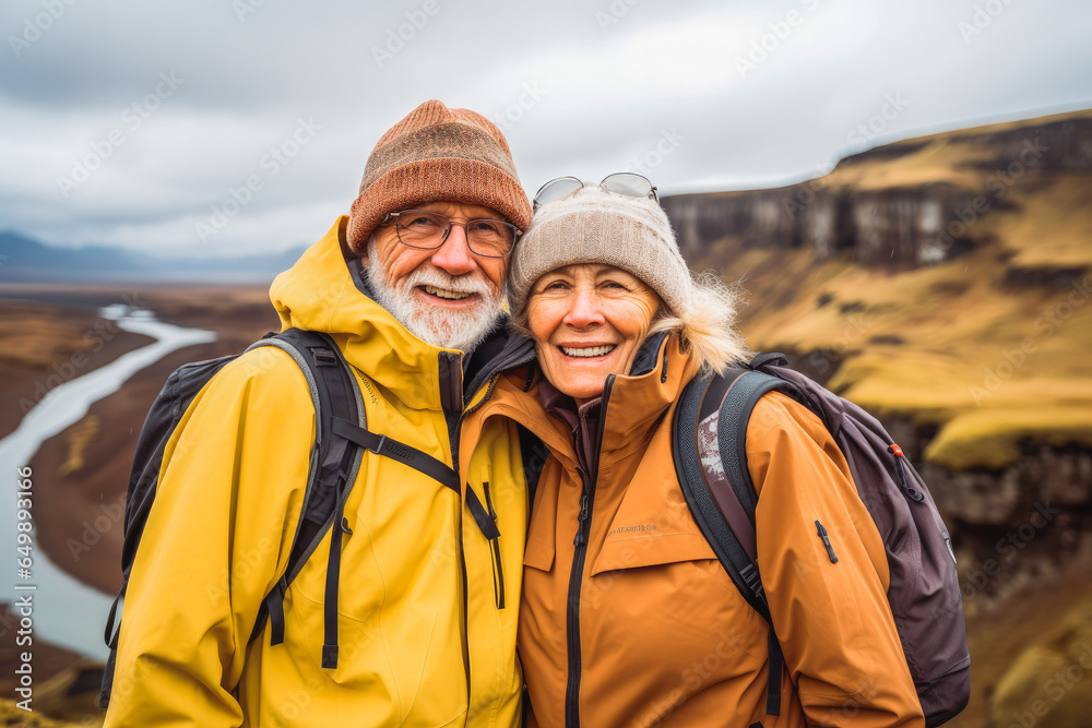 Multiethnic couple traveling in Iceland. Happy older travelers exploring in nature. Multiethnic couple traveling in Iceland. Happy older travelers exploring in nature.