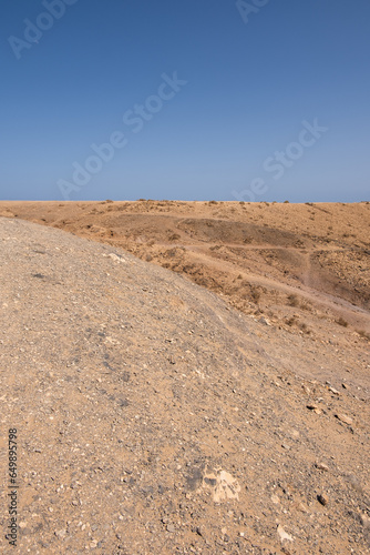 Deserted landscape of natural beach of white sand. Cove. Papagayo beach, Lanzarote. Clear sky. Canary Islands, Spain