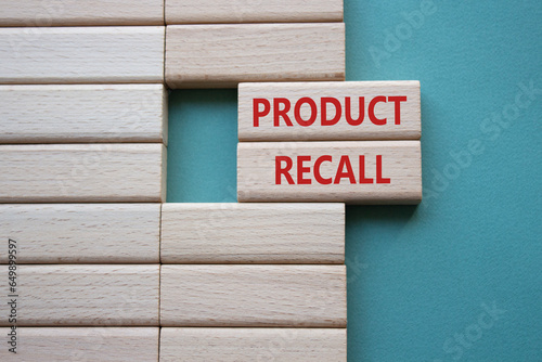 Product recall symbol. Concept words Product recall on wooden blocks. Beautiful grey green background. Business and Product recall concept. Copy space.