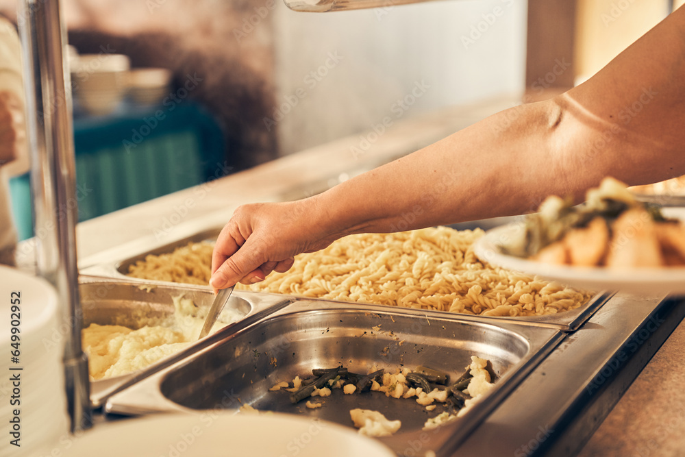 A hand serving food to the homeless. People receiving donations from a good friend, the concept of careful giving. High quality photo