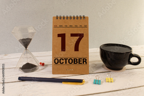 October 17th . October 17 white wooden calendar on white background. Autumn day. Copy space for your text.