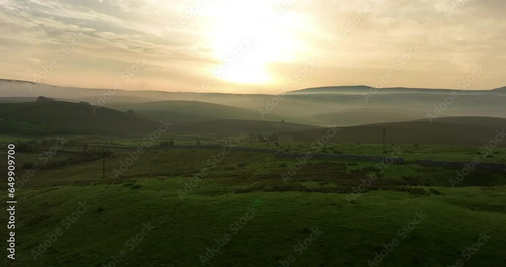Flying over misty hills at sunrise Flying over misty hills at sunrise