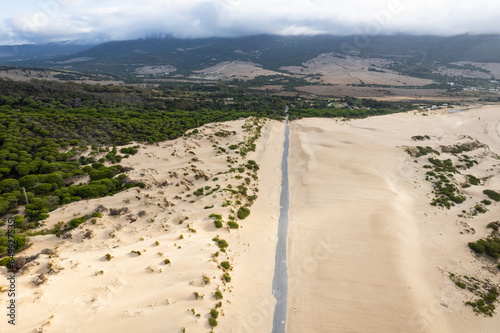 Drone view of Duna de Valdevaqueros ( The Valdevaqueros Dune ) white sand dunes in Tarifa, Spain. photo