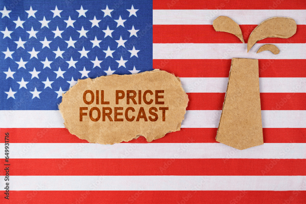 Obraz premium On the US flag there is an oil rig cut out of cardboard and a sign with the inscription - Oil Price Forecast