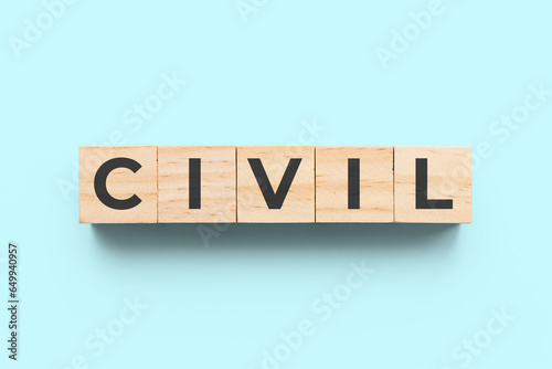 Valokuva Civil wooden cubes on light blue background