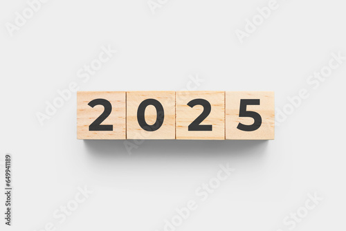 2025 wooden cubes on grey background
