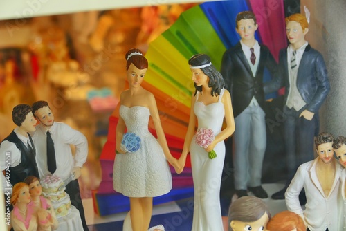 lgbtq wedding cake topper on display at shop window photo