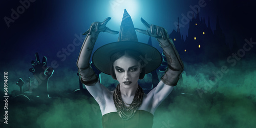 Scary young witch at cemetery