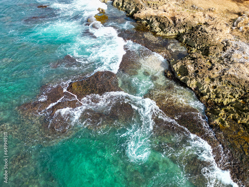 The West Coast of Oahu, Hawaii, showing the rugged coast and waves and the Stark Energy of Erosion.