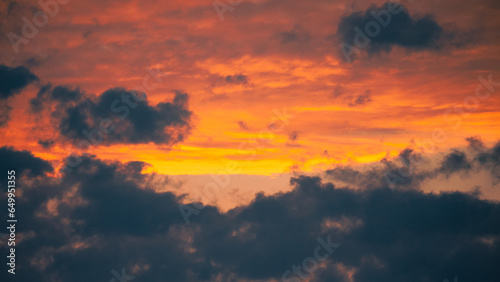 Dark clouds during orange sunrise