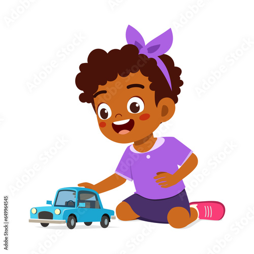 little kid play toy car model and feeling happy