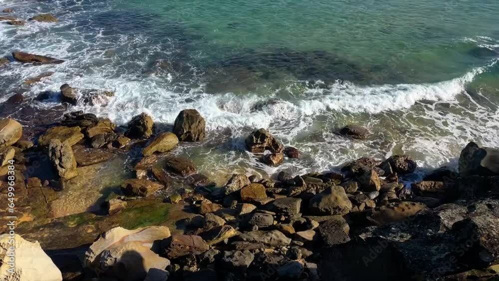 Ocean waves roll into the rocks Ocean waves roll into the rocks