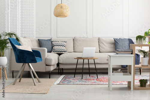 Stylish living room with beautiful carpet and modern furniture. Interior design © New Africa