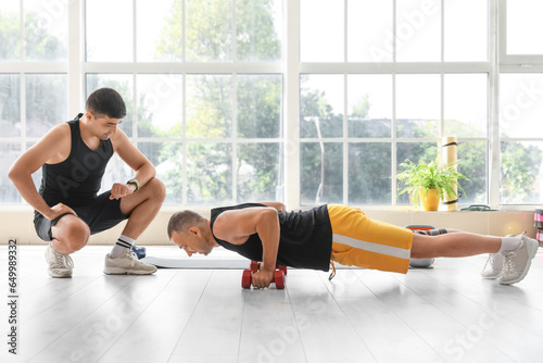 Mature man training with du...