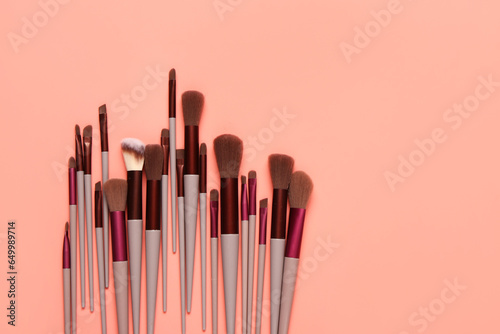 Makeup brushes on red background