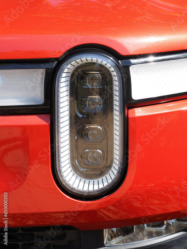 Modern electro car headlight close-up.