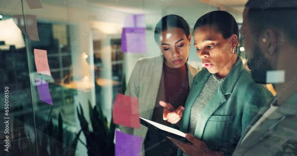 Business team, tablet and notes on board in an office for training, meeting or ideas. Men and women talking strategy, planning or scrum for pitch with technology, leader and a collaboration at night