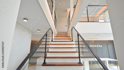 The handrail on the stairs going up to the second floor was made of a metal frame