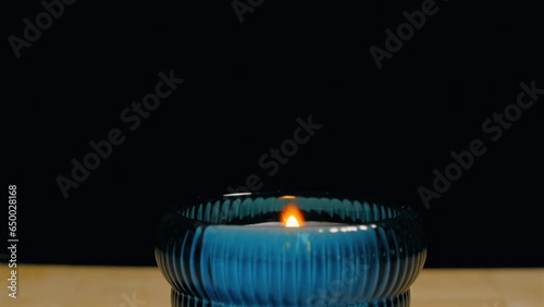 Lighting a candle with a disposable cigarette lighter - isolated close up photo